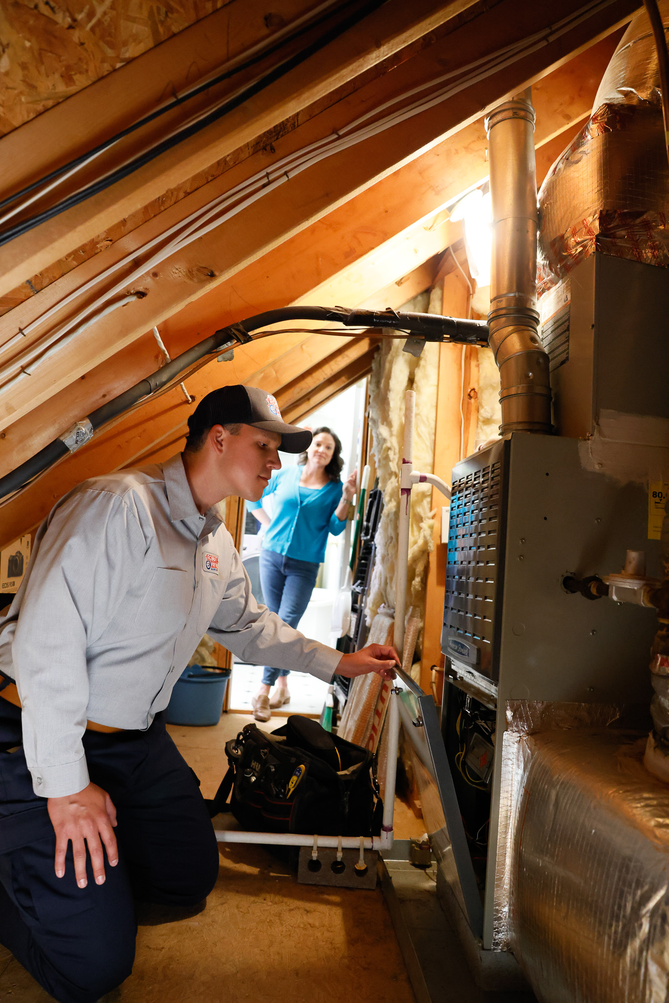A heating system in a home's basement, connected to ductwork.