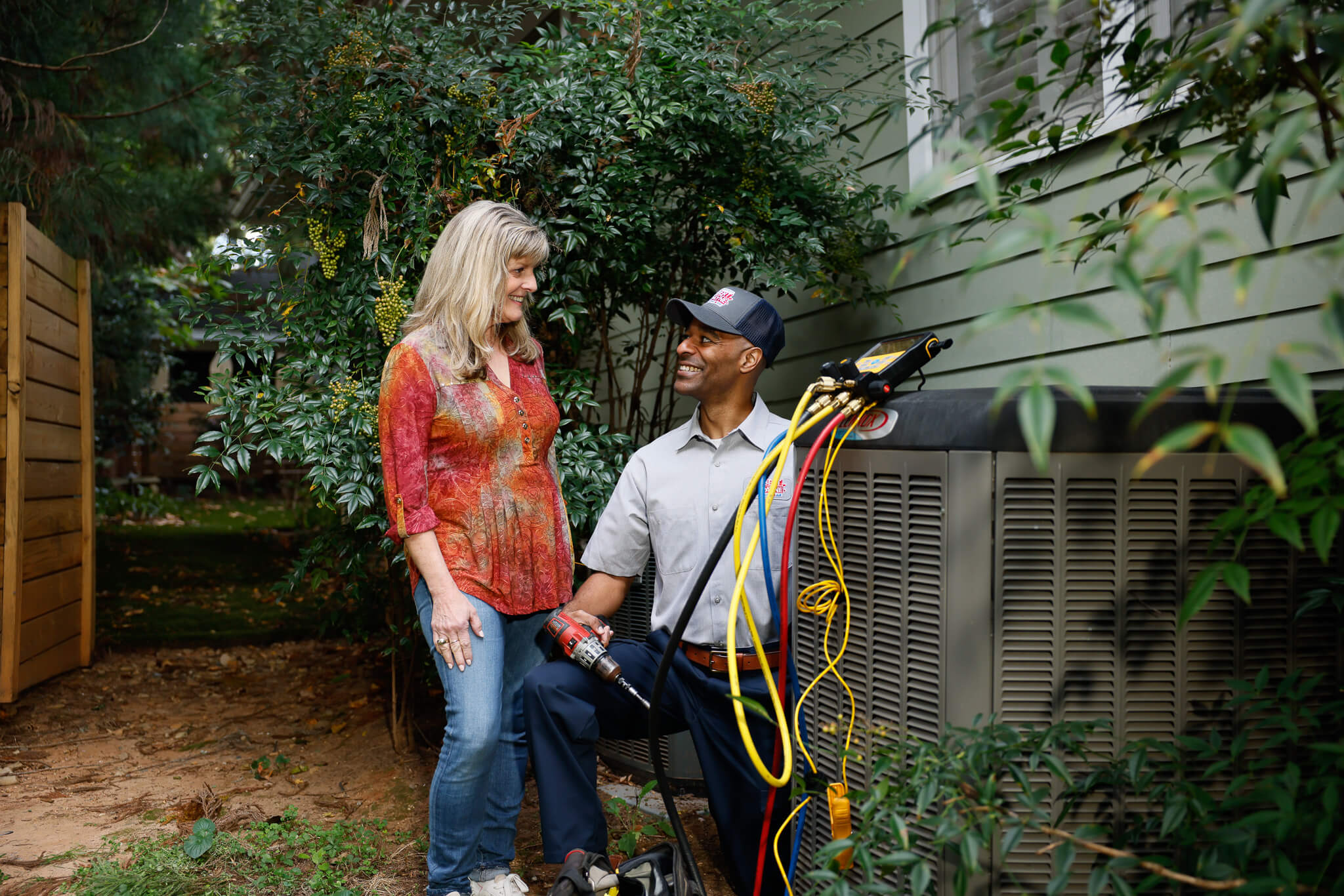HVAC unit installed next to a brick home