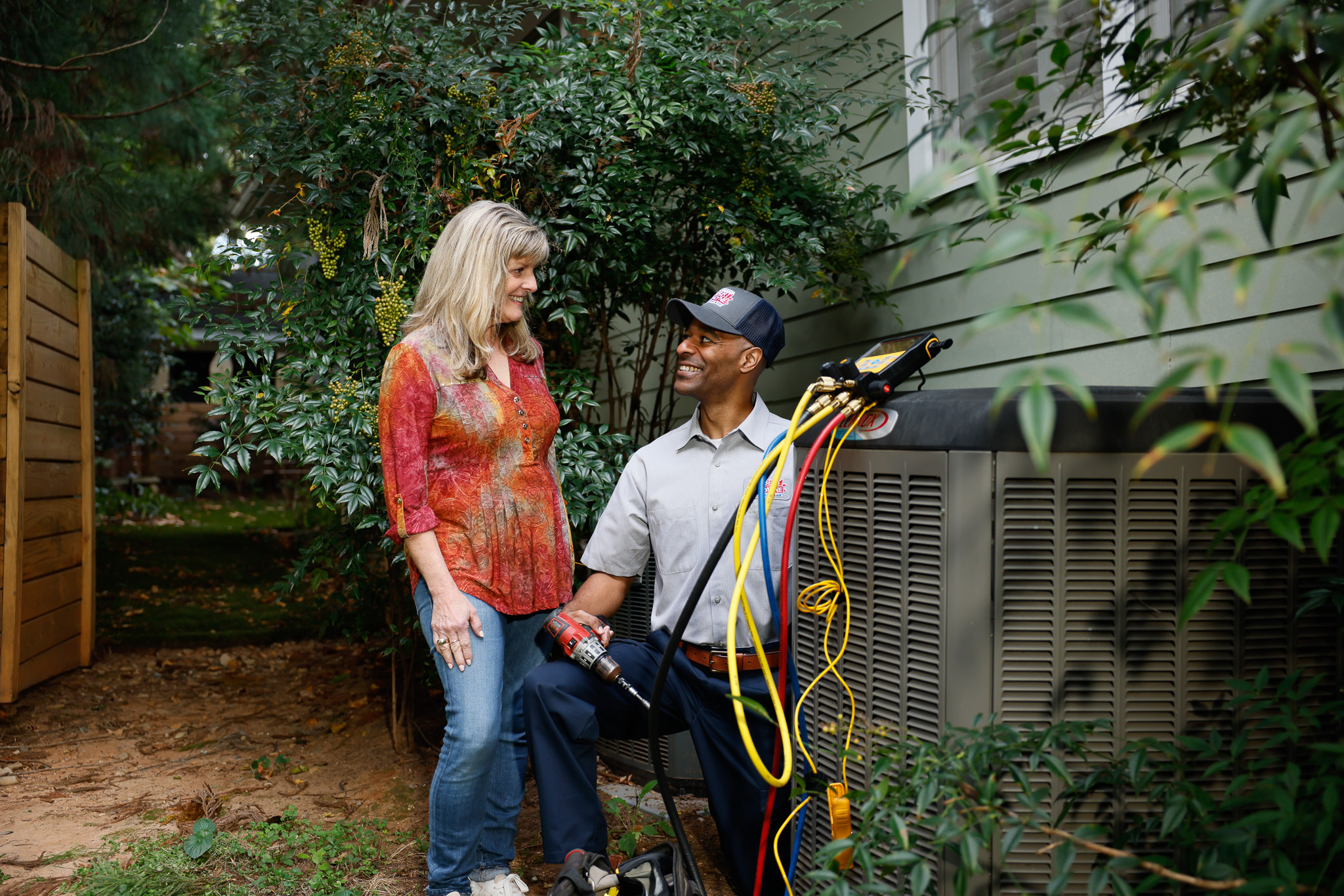 HVAC unit installed next to a brick home